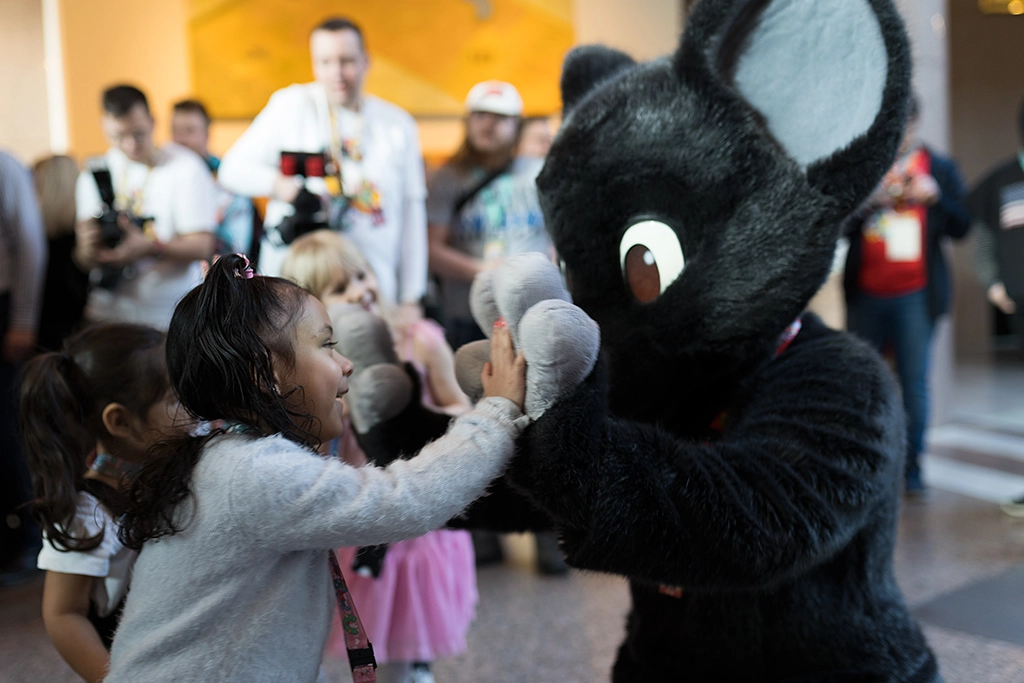 Portrait Photo of Mausie and an Open House Visitor